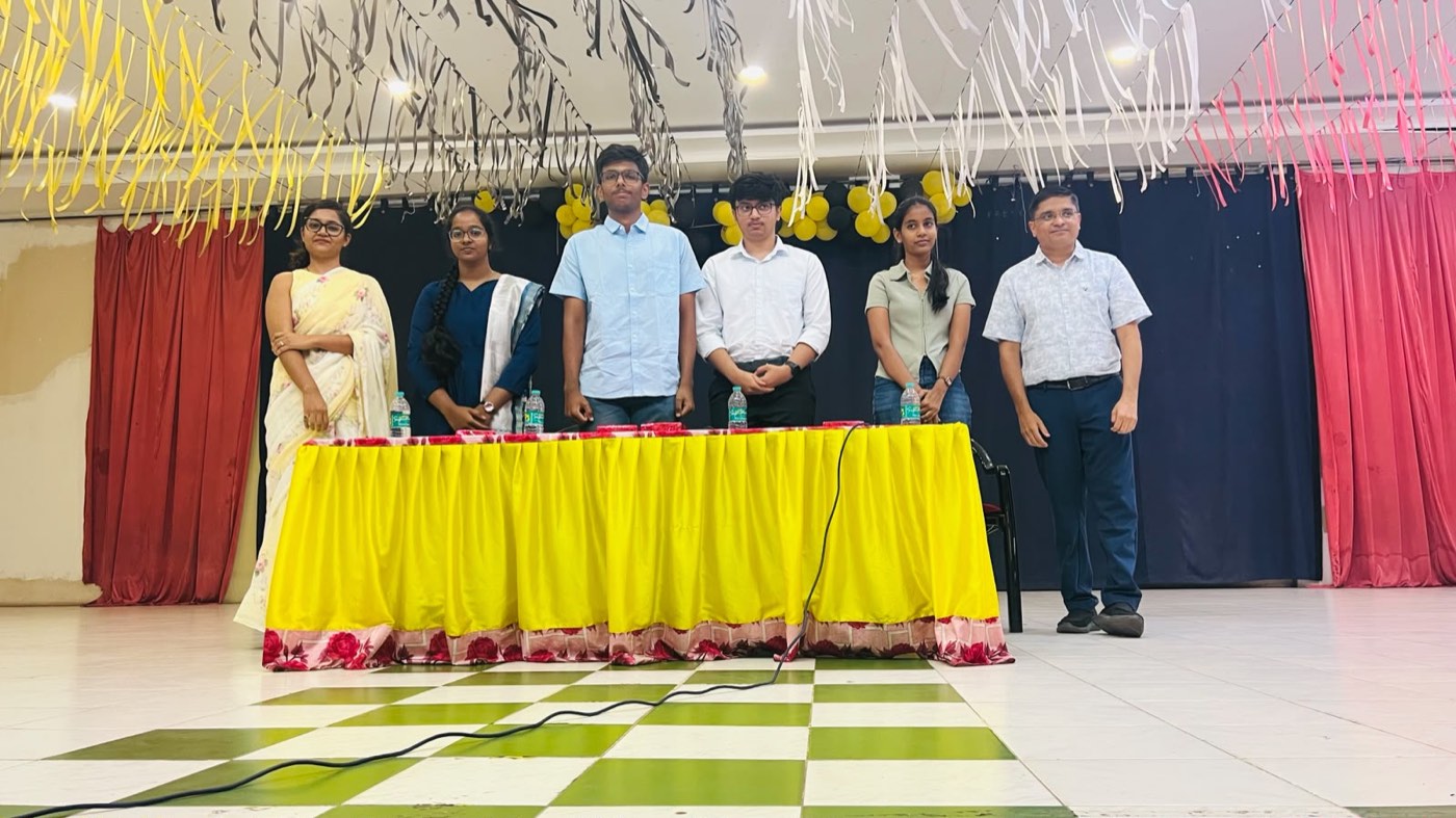 The toppers and moderators on stage at the event